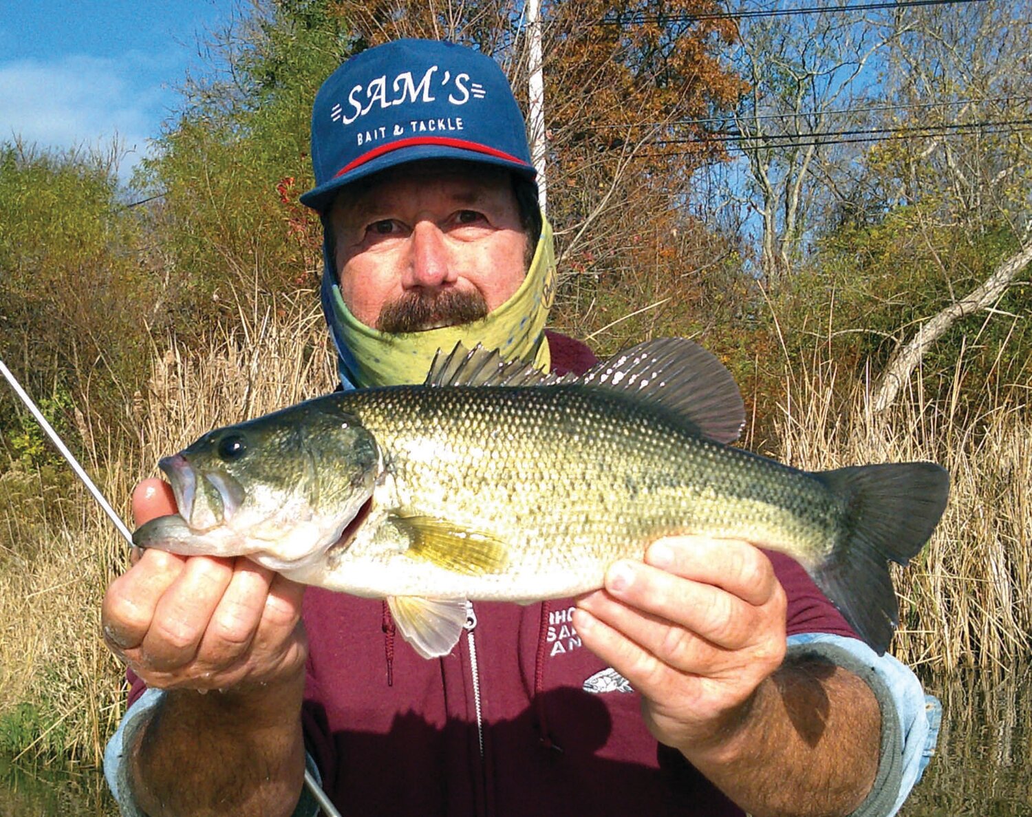 LARGEMOUTH BASS BITE: John Migliori with an Aquidneck Island largemouth bass said, “Sunday morning I caught this nice 17 inch largemouth using a Kastmaster lure.” (Submitted photos)